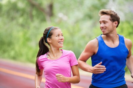 happy healthy woman and man running